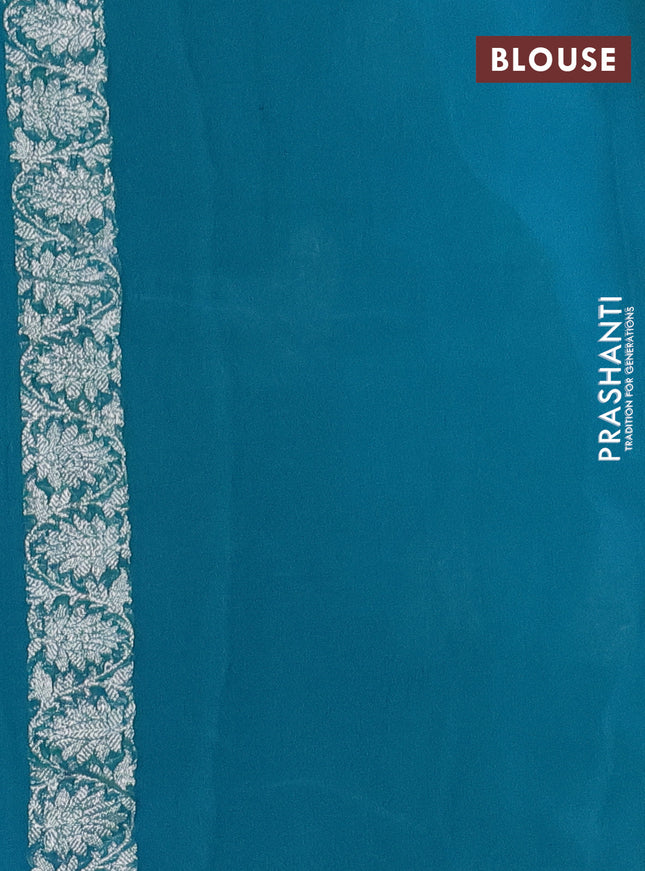 Banarasi chiffon silk saree light blue and teal green with silver zari woven buttas and silver zari woven border
