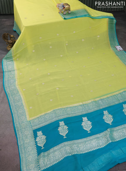 Banarasi chiffon silk saree lime yellow and teal blue with silver zari woven buttas and silver zari woven border