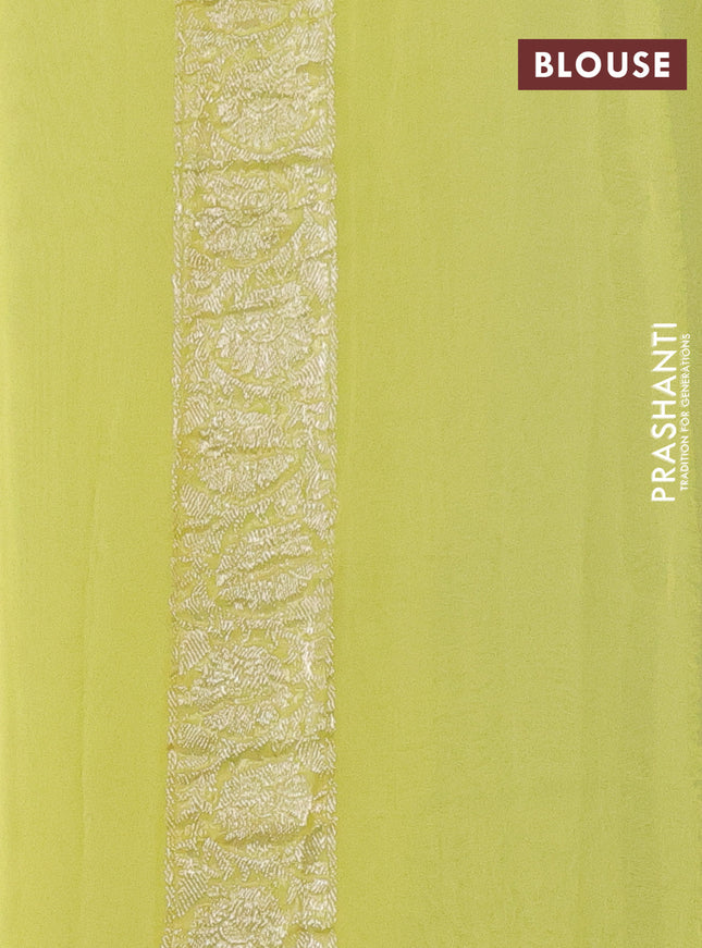 Banarasi chiffon silk saree black and pale yellow with silver zari woven buttas and silver zari woven border