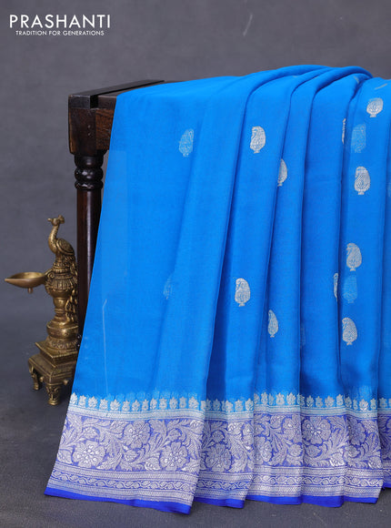 Banarasi chiffon silk saree cs blue and blue with paisley silver zari woven buttas and floral silver zari woven border