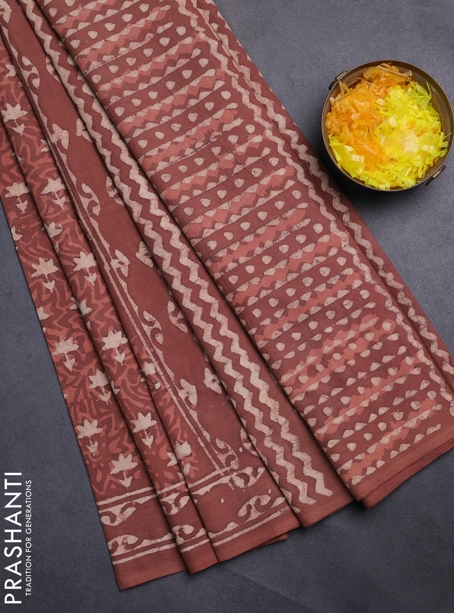 Jaipur cotton saree rust shade with allover dabu prints and printed border