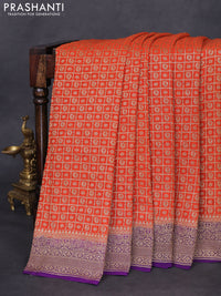 Banarasi georgette saree orange and violet with allover checked pattern & woven buttas and woven border