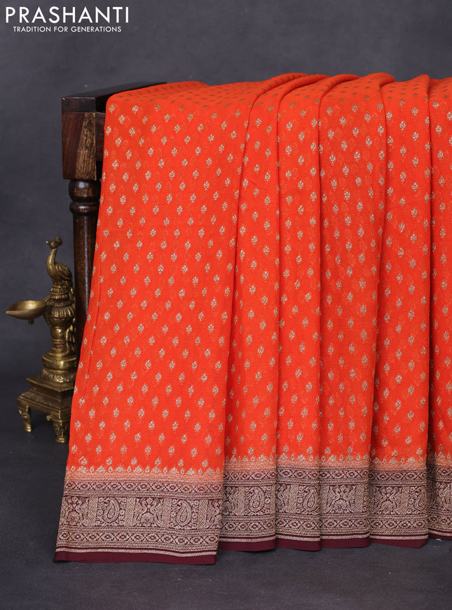 Banarasi georgette saree orange and coffee brown with allover thread & zari woven butta weaves and woven border