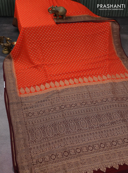 Banarasi georgette saree orange and coffee brown with allover thread & zari woven butta weaves and woven border