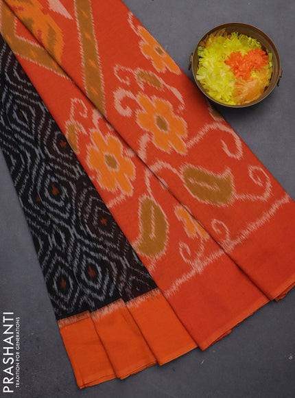 Ikat cotton saree black and orange with allover ikat weaves and simple border
