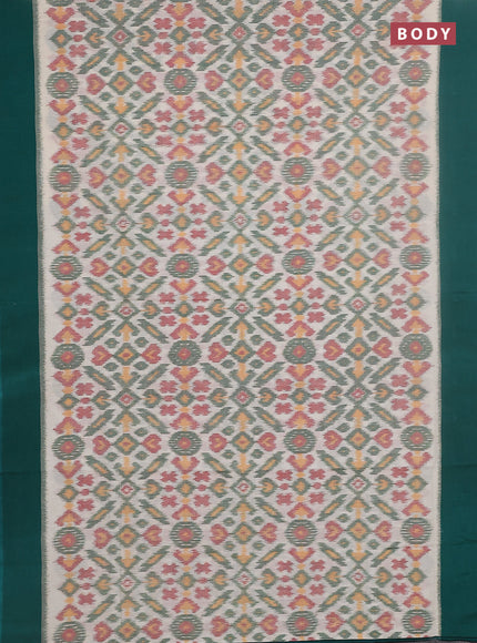 Ikat cotton saree cream and teal green with allover ikat weaves and simple border