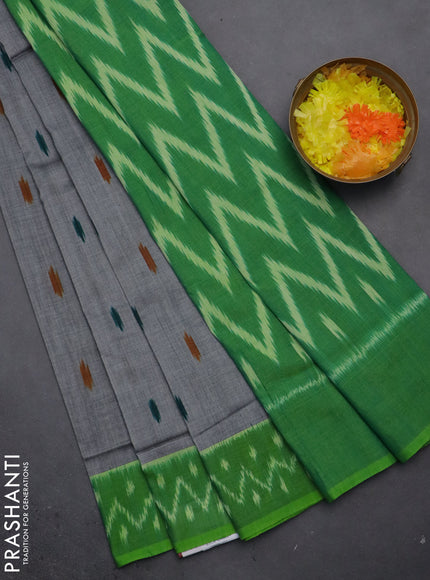 Ikat cotton saree grey and green with allover ikat butta weaves and ikat style border