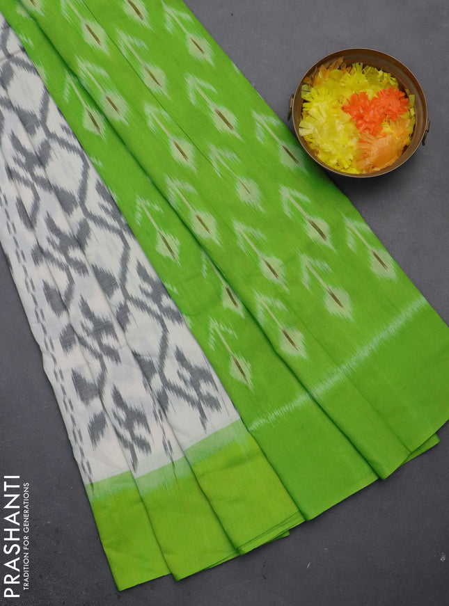 Ikat cotton saree off white and light green with allover ikat weaves and simple border