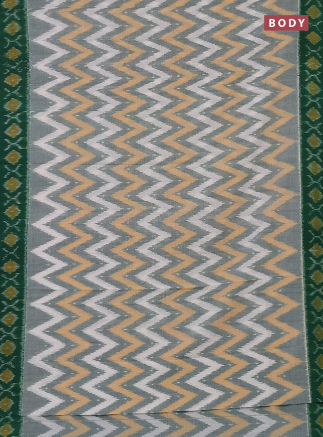 Ikat cotton saree green shade with allover ikat weaves and simple border