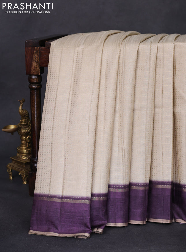 Semi matka saree cream and deep jamun with allover zari weaves and rettapet zari woven border