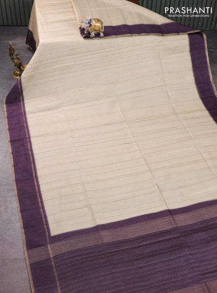 Semi matka saree cream and deep jamun with allover zari weaves and rettapet zari woven border