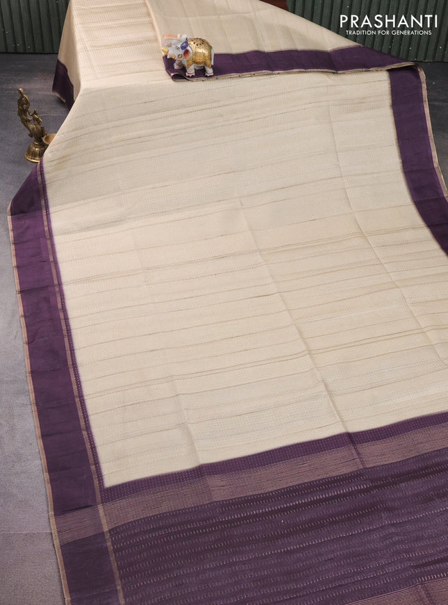 Semi matka saree cream and deep jamun with allover zari weaves and rettapet zari woven border