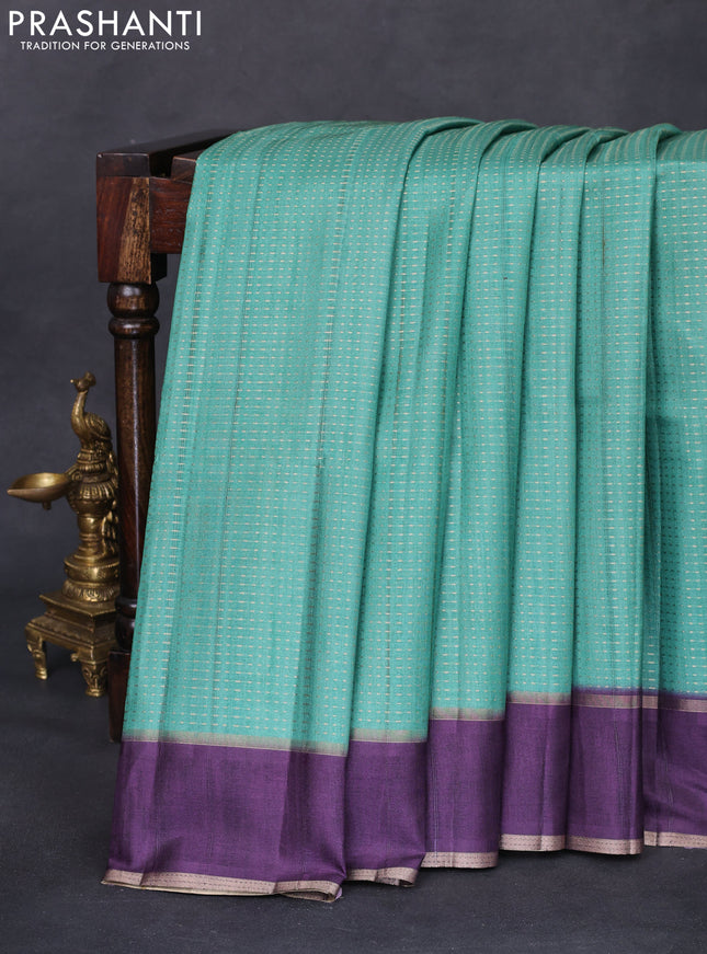 Semi matka saree teal green and deep jamun with allover zari weaves and rettapet zari woven border