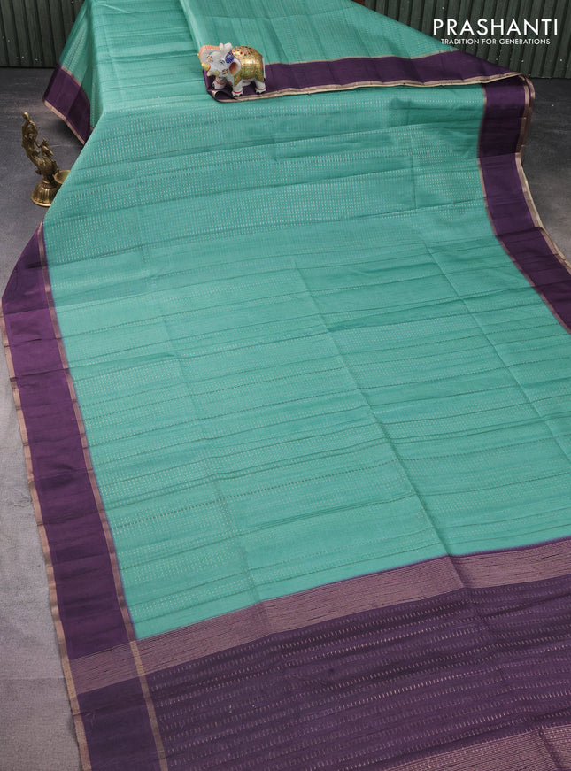 Semi matka saree teal green and deep jamun with allover zari weaves and rettapet zari woven border