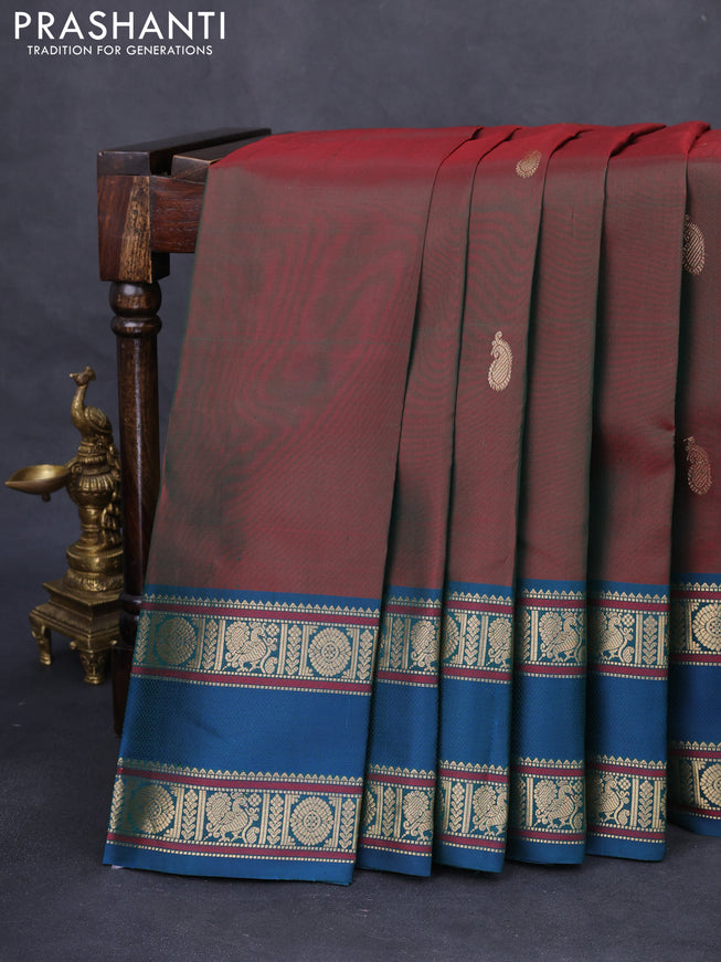 Pure kanchipuram silk saree dual shade of manthulir green and dual shade of peacock blue with zari woven buttas and rettapet zari woven border