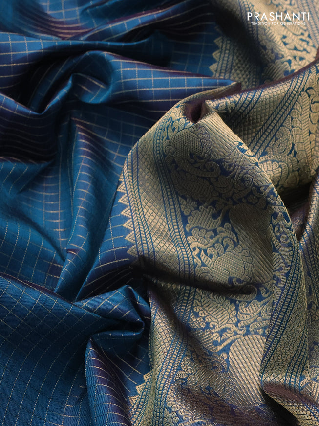Pure kanchipuram silk saree dual shade of peacock blue with allover zari woven checked pattern and rettapet zari woven butta border