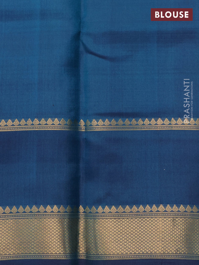 Pure kanchipuram silk saree dual shade of peacock blue with allover zari woven checked pattern and rettapet zari woven butta border