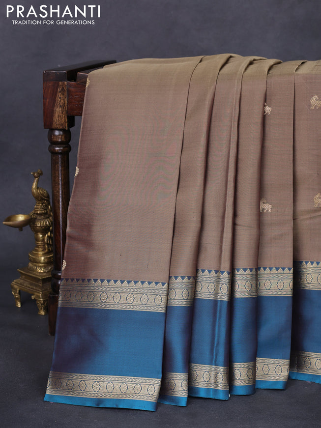 Pure kanchipuram silk saree chikku shade and peacock green with zari woven buttas and long rettapet zari woven border