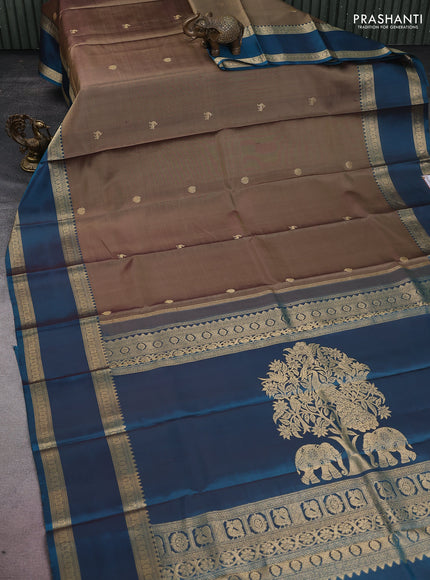 Pure kanchipuram silk saree chikku shade and peacock green with zari woven buttas and long rettapet zari woven border