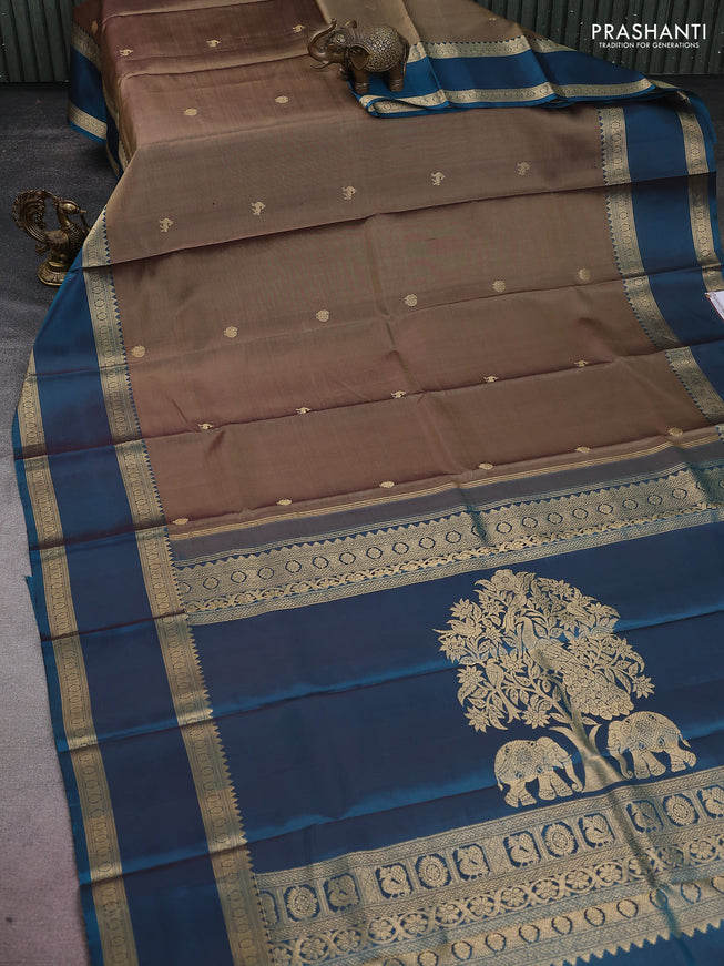 Pure kanchipuram silk saree chikku shade and peacock green with zari woven buttas and long rettapet zari woven border