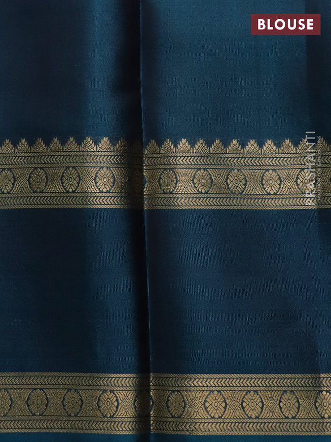 Pure kanchipuram silk saree chikku shade and peacock green with zari woven buttas and long rettapet zari woven border