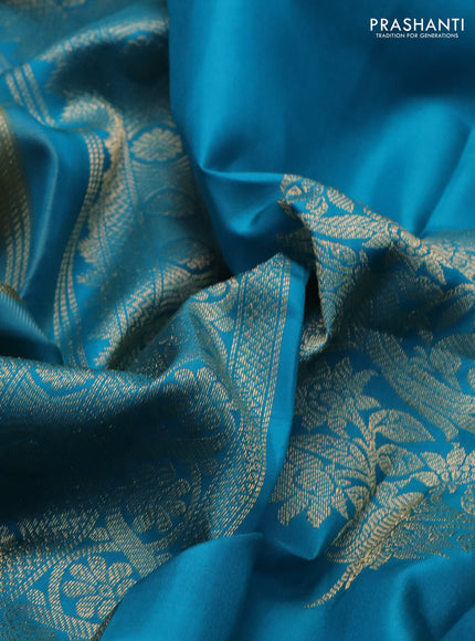 Pure kanchipuram silk saree dual shade of teal bluish green and teal blue with zari woven buttas and long rettapet zari woven border