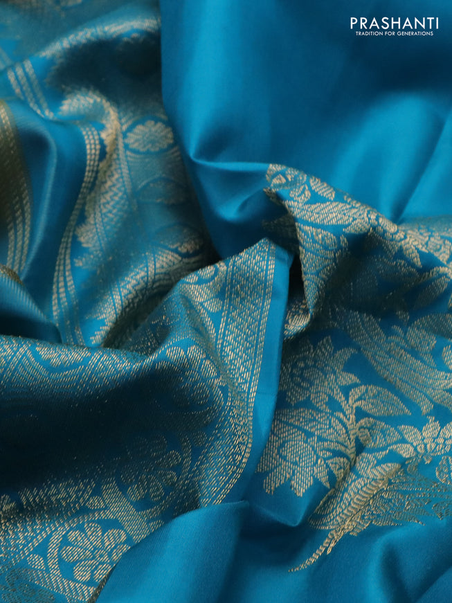 Pure kanchipuram silk saree dual shade of teal bluish green and teal blue with zari woven buttas and long rettapet zari woven border