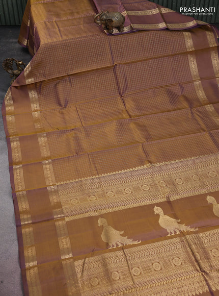 Pure kanchipuram silk saree dual shade of mehendi green and violet with allover zari woven checked pattern and rettapet zari woven border