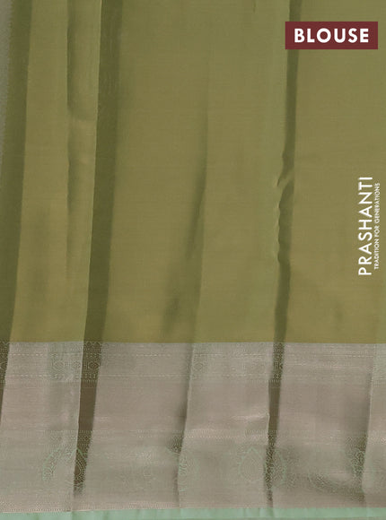 Semi kanchipuram tissue silk saree pista green with allover silver zari woven brocade weaves and long zari woven border