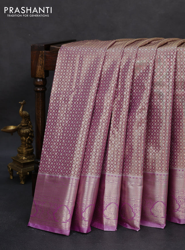 Semi kanchipuram tissue silk saree dual shade of lavender and lavender with allover silver zari woven brocade weaves and zari woven border