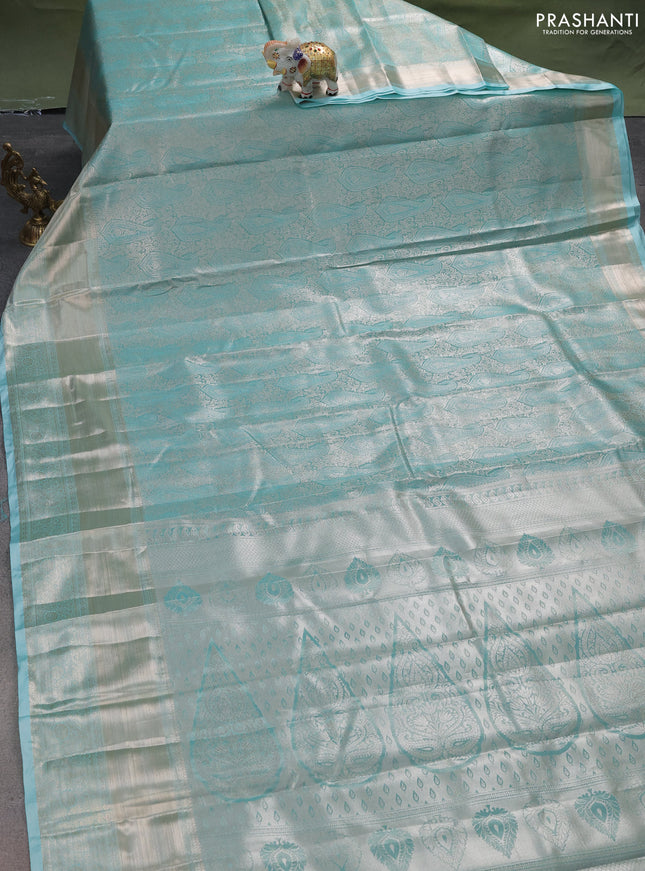 Semi kanchipuram tissue silk saree teal blue with allover silver zari woven brocade weaves and long zari woven border