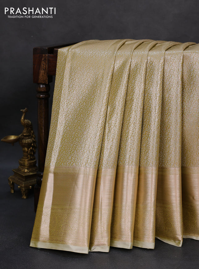 Semi kanchipuram tissue silk saree elaichi green with allover silver zari woven brocade weaves and long zari woven border