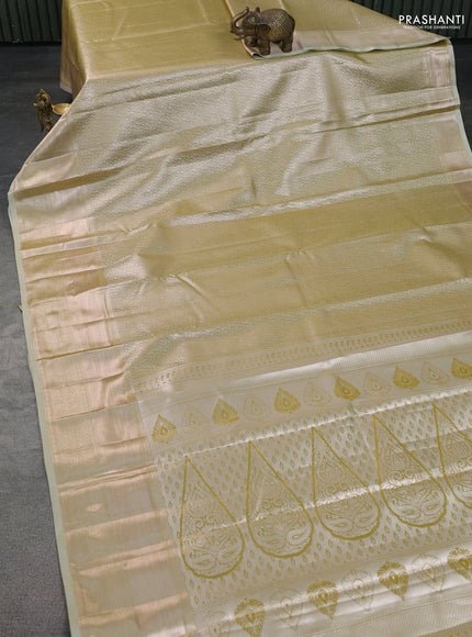 Semi kanchipuram tissue silk saree elaichi green with allover silver zari woven brocade weaves and long zari woven border