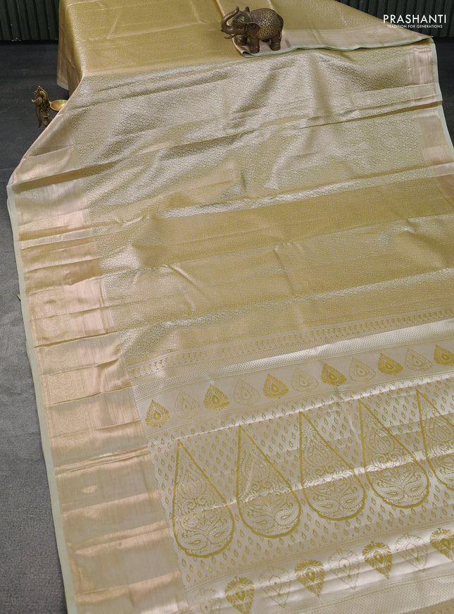 Semi kanchipuram tissue silk saree elaichi green with allover silver zari woven brocade weaves and long zari woven border