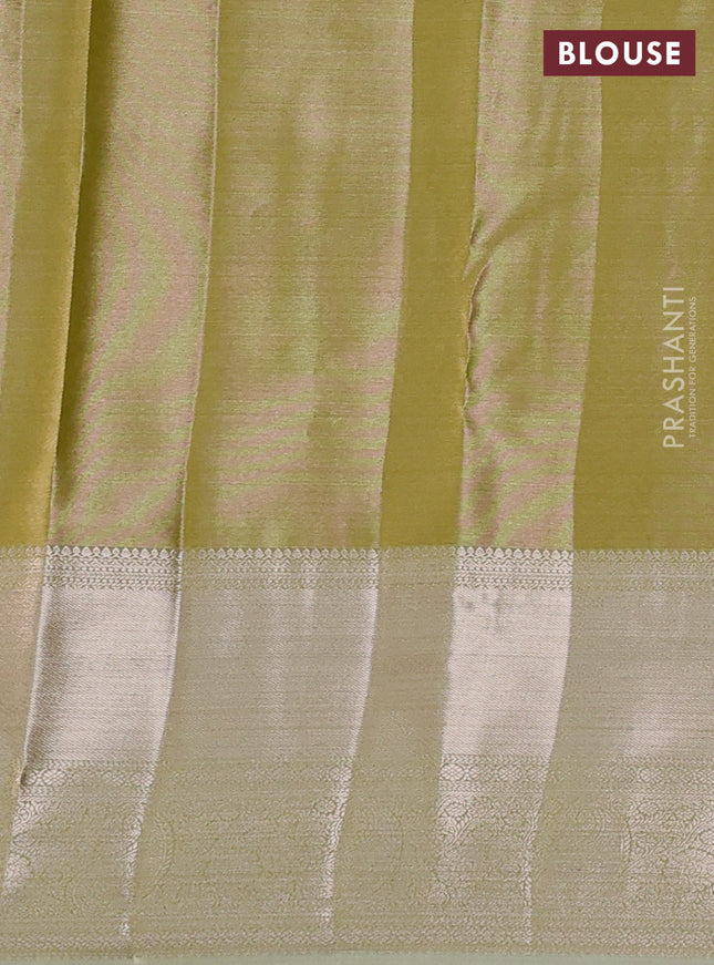 Semi kanchipuram tissue silk saree elaichi green with allover silver zari woven brocade weaves and long zari woven border