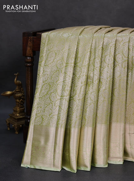Semi kanchipuram tissue silk saree pista green with allover silver zari woven brocade weaves and zari woven border