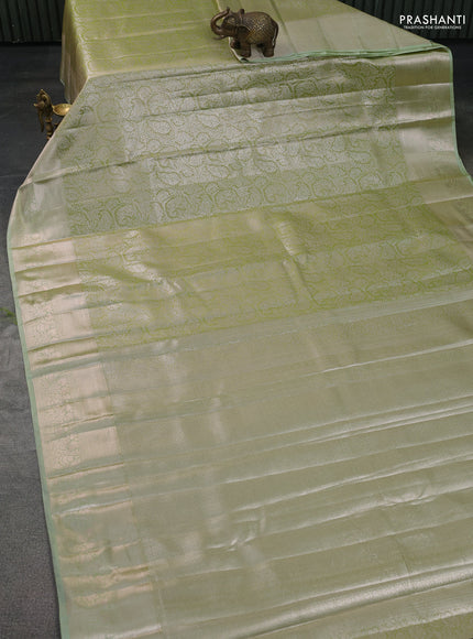 Semi kanchipuram tissue silk saree pista green with allover silver zari woven brocade weaves and zari woven border