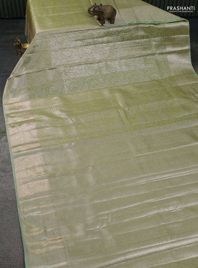 Semi kanchipuram tissue silk saree pista green with allover silver zari woven brocade weaves and zari woven border