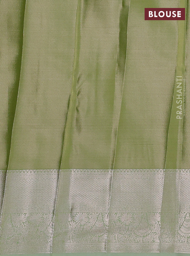 Semi kanchipuram tissue silk saree pista green with allover silver zari woven brocade weaves and zari woven border