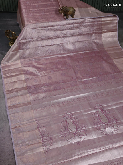 Semi kanchipuram tissue silk saree pastel pink and pastel lavender with allover silver zari woven brocade weaves and long zari woven border