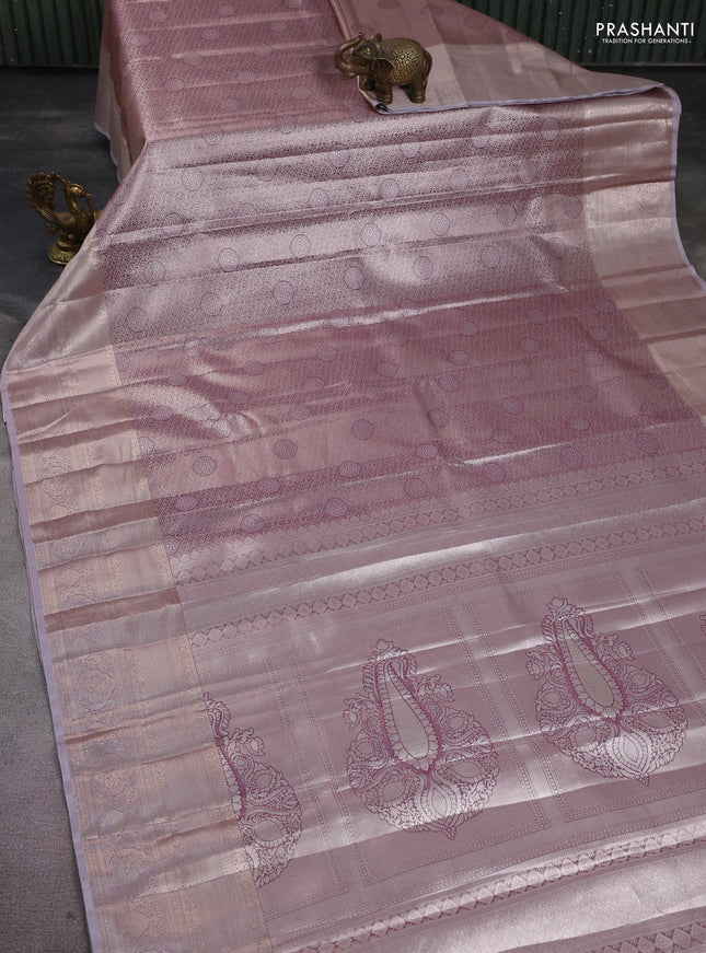 Semi kanchipuram tissue silk saree pastel pink and pastel lavender with allover silver zari woven brocade weaves and long zari woven border