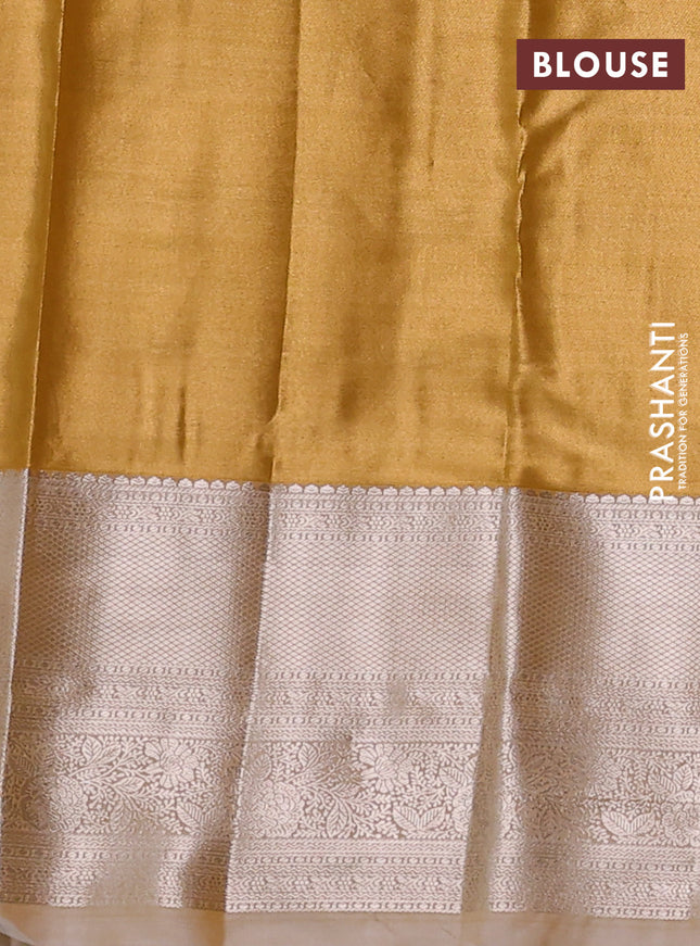 Semi kanchipuram tissue silk saree mustard yellow with allover silver zari woven brocade weaves and long zari woven border