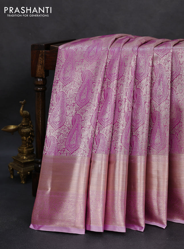 Semi kanchipuram tissue silk saree lavender with allover silver zari woven paisley brocade weaves and long zari woven border