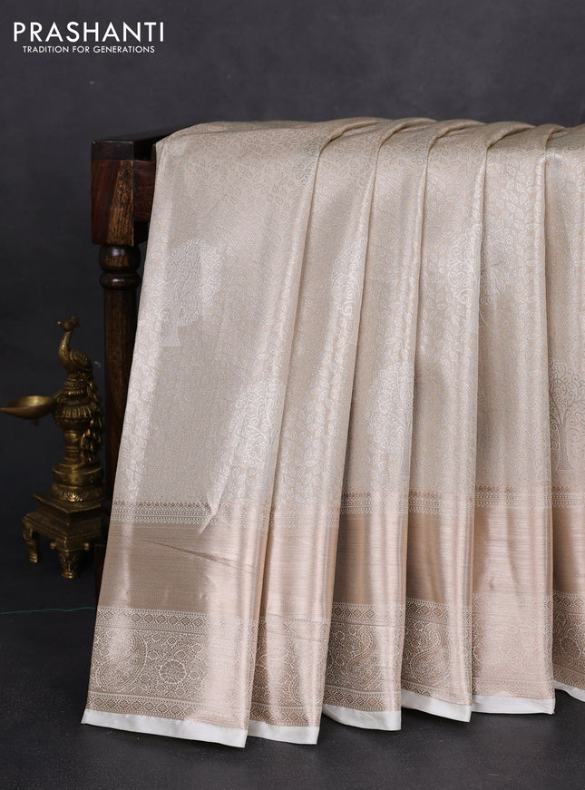 Semi kanchipuram tissue silk saree cream with allover silver zari woven brocade weaves and long zari woven border