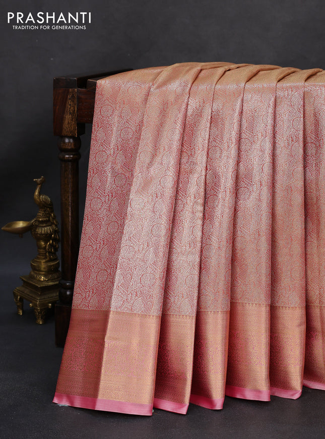 Semi kanchipuram tissue silk saree dual shade of peach and peach pink with allover silver zari woven brocade weaves and zari woven border