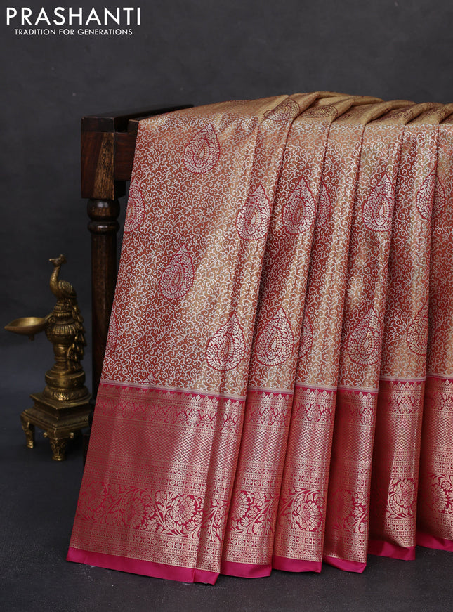 Semi kanchipuram tissue silk saree dual shade of gold and dark magenta pink with allover silver zari woven brocade weaves and long zari woven border