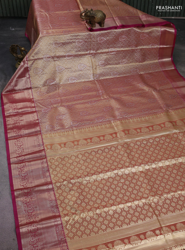 Semi kanchipuram tissue silk saree dual shade of gold and dark magenta pink with allover silver zari woven brocade weaves and long zari woven border