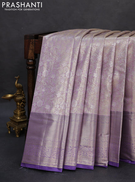 Semi kanchipuram tissue silk saree mild lavender and lavender with allover silver zari woven brocade weaves and long zari woven border