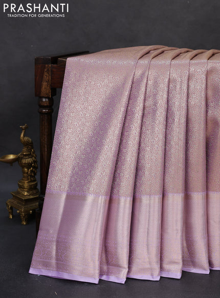 Semi kanchipuram tissue silk saree mild lavender and lavender with allover silver zari woven brocade weaves and long zari woven border