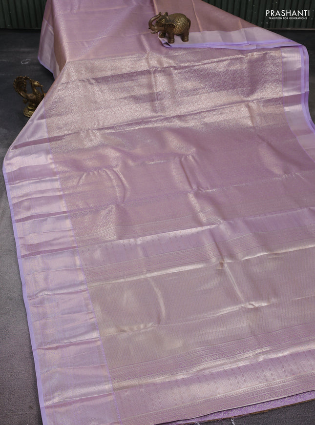 Semi kanchipuram tissue silk saree mild lavender and lavender with allover silver zari woven brocade weaves and long zari woven border